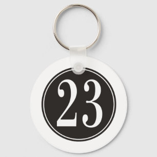 Numrera 23 - Svarten cirklar (bekläda) Nyckelring