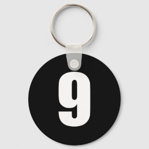 numrera 9 i vit på svart knäppas keychain nyckelring