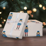 Nutcracker-jul Presentpapper<br><div class="desc">En julomslutning papper med en illustration av Nutcracker mönster och några stjärnor på en ljusbrun bakgrund. Perfekt att dekorera era Julafton-gåvor!</div>