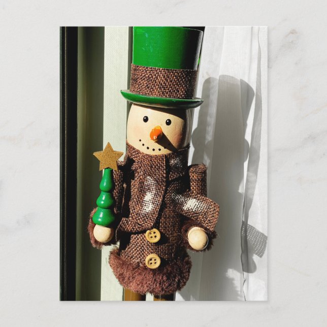 Nutcracker som står i fönstret vykort (Framsida)