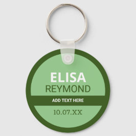nyckel med namn och datum i grönt nyckelring