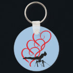 Nyckelkedja för Gymnastikknapp. Nyckelring<br><div class="desc">Gymnastikknappens nyckelkedja med gymnast och röda hjärtan.</div>