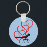 Nyckelkedja för Gymnastikknapp. Nyckelring<br><div class="desc">Gymnastikknappens nyckelkedja med gymnast och röda hjärtan.</div>