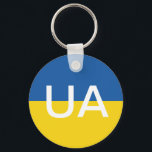 Nyckelkedja för ukrainsk flagga-ronknapp nyckelring<br><div class="desc">Nyckelring för ukrainsk flagga med runda knappar. Den blå gulten Ukraina-flagga med brev i monogram. Lägg till egen personlig eller offert.</div>