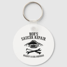 nyckelkedja med svarta Bob Saucer Repair logotyp