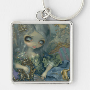 Nyckelkedjan "Delusion of Grandeur" Fyrkantig Silverfärgad Nyckelring