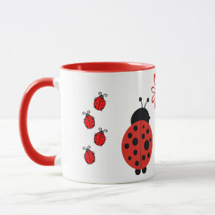 Nyckelpigor med blommamuggen mugg