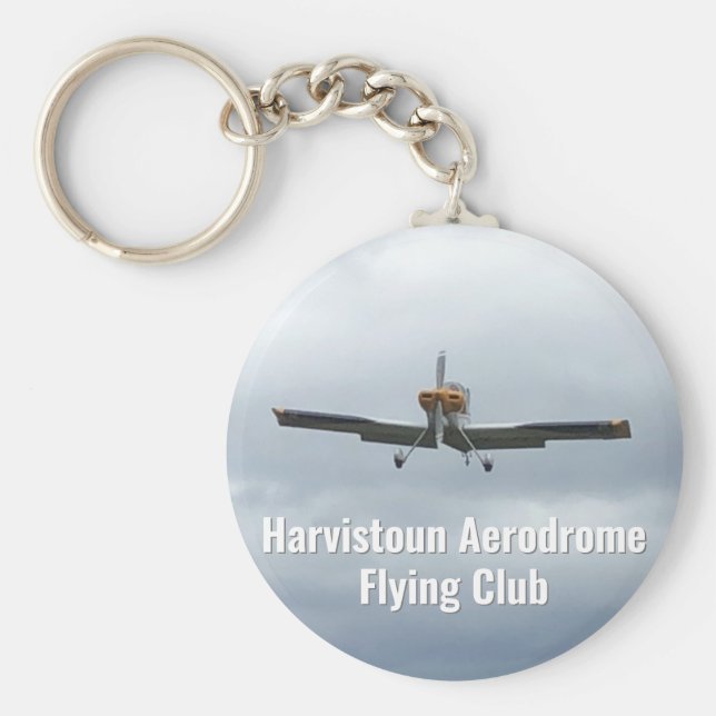 Nyckelring av flygande Klubb med lätta flygplan. (Framsidan)