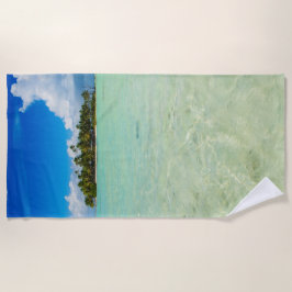 Obebodd ö i en tropisk blåttlagun