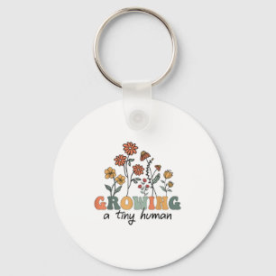 Odling av en liten mänsklig Blommigt Blommor Tee F Nyckelring