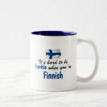 Ödmjuk finska Två-Tonad mugg<br><div class="desc">Detta "är det hårt att vara ödmjukt,  när du är den finlandssvenska" designen med den finlandssvenska flagga är en av många original- finlandssvenska skapelser vid Worldshop.</div>