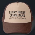 Official Lucky Ducky Trucky Hat-Words only Keps<br><div class="desc">the official Trucky Hat worn by legends, dreamers, and Quack Pack members everywhere. This ain’t your average cap. This is a brown-and-khaki crown of grit, embroidered in bold old gold with our Lucky Ducky logo — forged somewhere between Eastbound & Down and a Nebraska sunrise. Whether you’re loaded up and...</div>