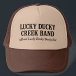 Official Lucky Ducky Trucky Hat-Words only Keps<br><div class="desc">the official Trucky Hat worn by legends, dreamers, and Quack Pack members everywhere. This ain’t your average cap. This is a brown-and-khaki crown of grit, embroidered in bold old gold with our Lucky Ducky logo — forged somewhere between Eastbound & Down and a Nebraska sunrise. Whether you’re loaded up and...</div>