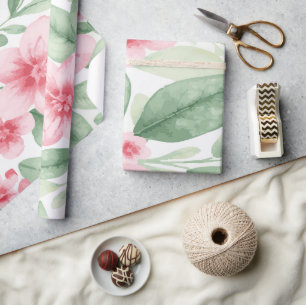 Ömtåliga rosa blommor med gröna blad på vit bakgru presentpapper