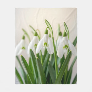 Ömtåliga vita snödroppsblommor vårblomning fleecefilt