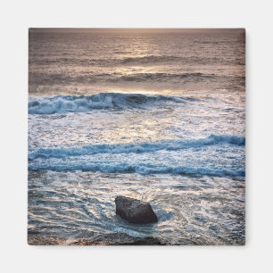 Ömtlig solnedgång på stranden magnet