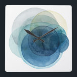 Omvandla planeter - Vattenfärgcirklar Fyrkantig Klocka<br><div class="desc">Att utveckla planeter jag av Grace Popp. Vattenfärgskretsar skapar planetliknande former som överlappar varandra för att avslöja vackra variationer av blått och teal.</div>