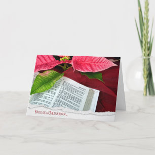 Öppna bibel med poinsettia helgkort