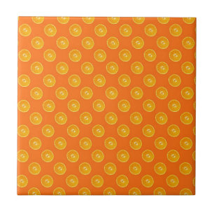 Orangar med orange bakgrund kakelplatta