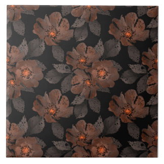 Orange and brown flowers on a black background. kakelplatta