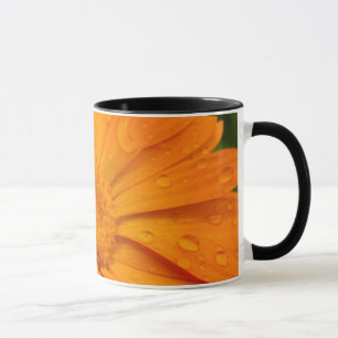 Orange blomma mugg