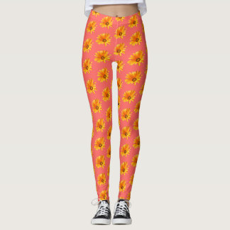 Orange Cape Daisy mot levande korallbakgrund. Leggings