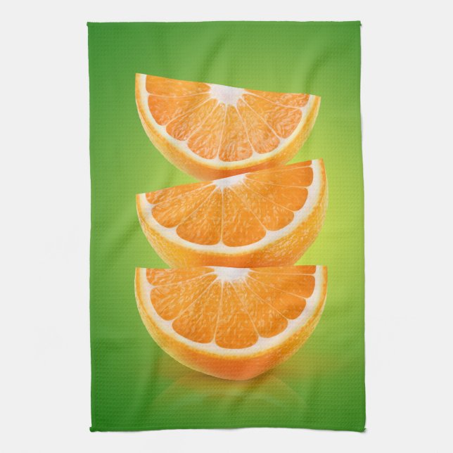 Orange delarare på grönt kökshandduk (Vertikal)