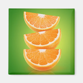 Orange delarare på grönt magnet