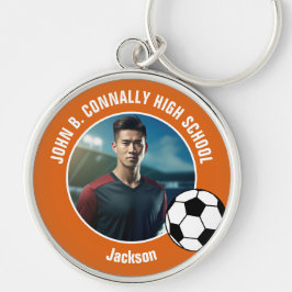 Orange fotbollsspelarbild gymnasieskola rund silverfärgad nyckelring
