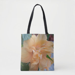 Orange hibiscus blomma på en tocksäck tygkasse