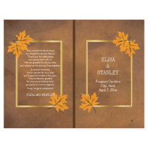 Orange kapsel löv på brunt bröllopsprogram