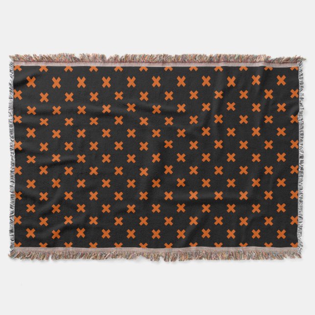 Orange kor sytlar på svart filt (Framsidan)