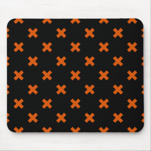 Orange kor sytlar på svart musmatta