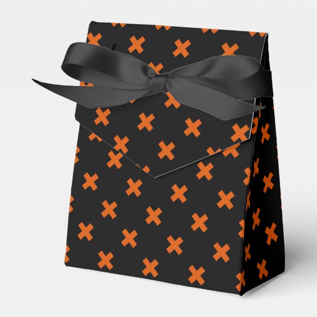 Orange kor sytlar på svart presentaskar (Framsidan Sidan)