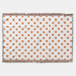 Orange kor sytlar på vitt filt