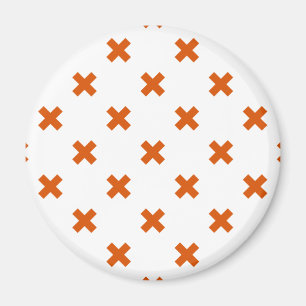 Orange kor sytlar på vitt magnet