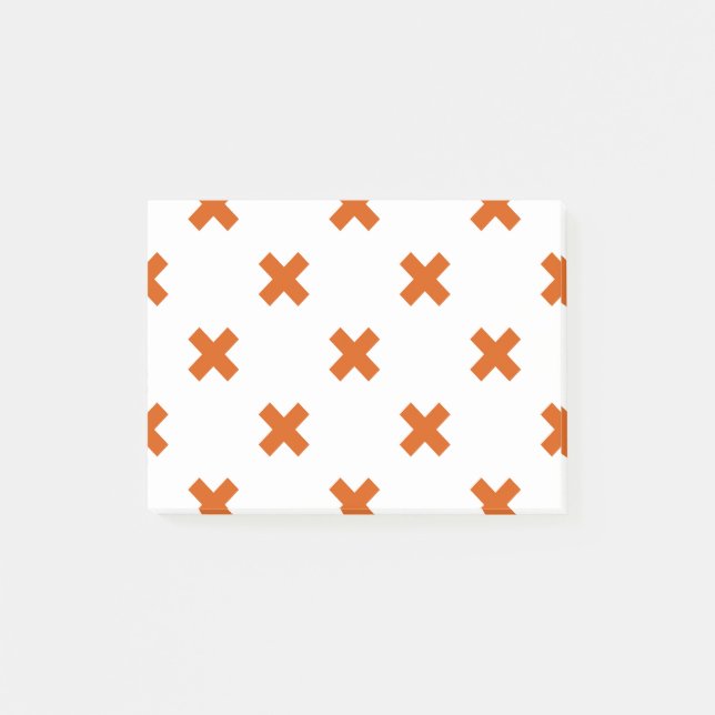 Orange kor sytlar på vitt post-it block (Framsida)