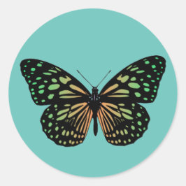 Orange och grönspräcklig fjäril runt klistermärke