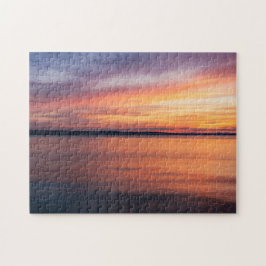 Orange- och Lila-solnedgångsklumpar över Sjö Vatte Pussel