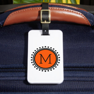 Orange- och svartpolkaen pricker monogramen bagagebricka