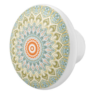 Orange och teal-mandalamönster med guldbekladdnad knopp