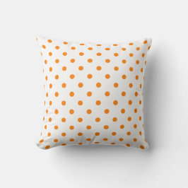 Orange och vit polka-punkt på en påk kudde