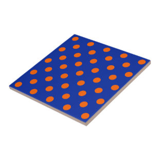 Orange på blå prickmönsterdesign kakelplatta