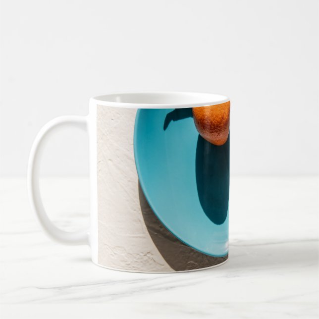 Orange på platta kaffemugg (Vänster)