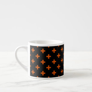 Orange polka kor på svart espressomugg