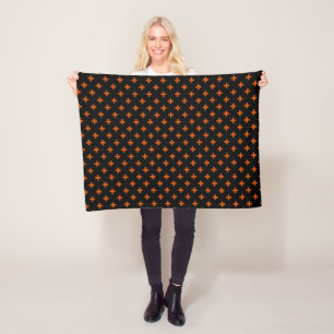 Orange polka kor på svart fleecefilt