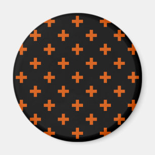 Orange polka kor på svart magnet