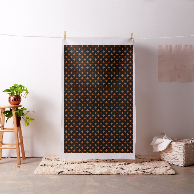 Orange polka kor på svart tyg (In Situ)