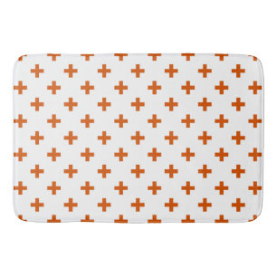 Orange polka kor på vitt badrumsmatta