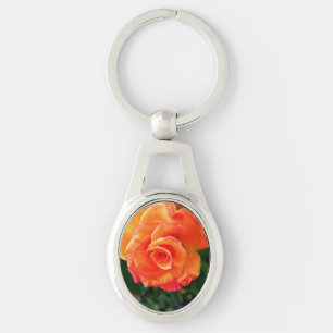 Orange ro blomma ovalt silverfärgad nyckelring
